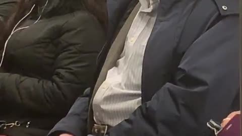 Old man on subway train sings opera out loud