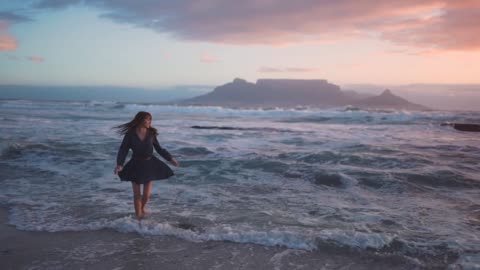 A Woman running towards sea water | Her happiness can be seen