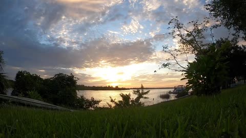 Beautiful Sunrise Over Calm Waters in a Time Lapse Video.