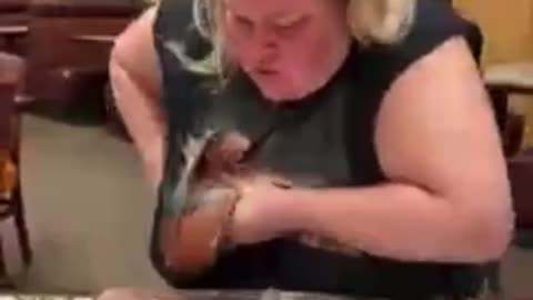 Woman eating nachos crushing a cockroach with her boob WTF !