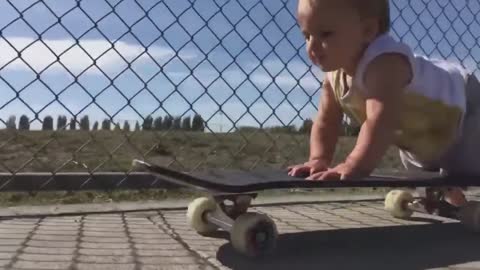 baby riding a crazy skateboarding