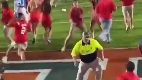 Female Ole Miss fan bulldozed by security while trying to storm field