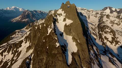 Shots of a mountain range filled with snow