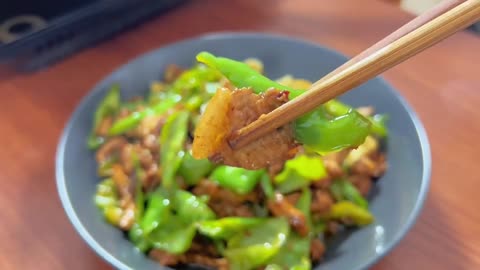 "Spicy Chili Stir-Fried Pork Recipe - Satisfy Your Cravings with a Fiery Kick!"