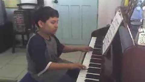 Pre-teen Nico practicing piano (Part 1)