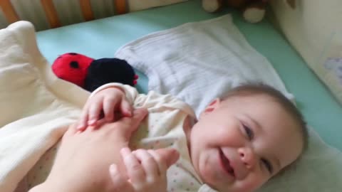 Cute 7 month old baby laughing