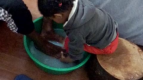 My daughter washing her father's feet