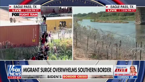 The national guardsmen puts in a ladder to help the illegals get in