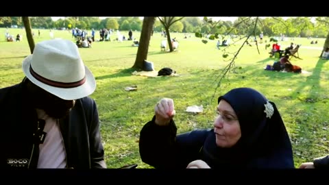 Muslims explaining changes within Arabic Qurans Paperboy Speakers Corner