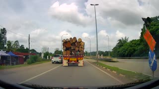 Car Nearly Crashes After Attempt to Overtake Truck