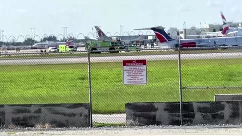 Smoke billows from plane that caught fire on landing in Miami