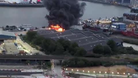 HUGE FIRE ERUPTS NEAR LONDON’S O2 ARENA AFTER EXPLOSIONS