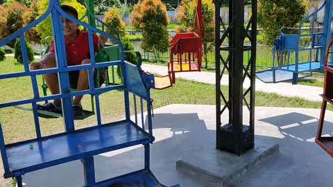 One small boy and girls playing in beautiful Park