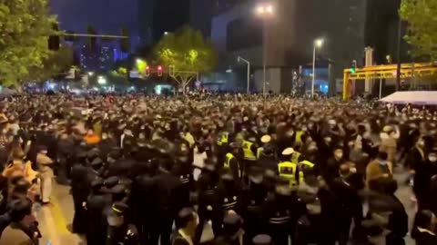 Wuhan protesters tear down lockdown barriers