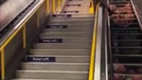 Friend tries to slide down an escalator