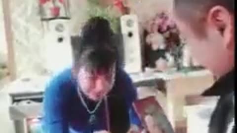 A Chinese Han man who 'Owns' a forced marriage Uyghur woman makes her to bow down to him.