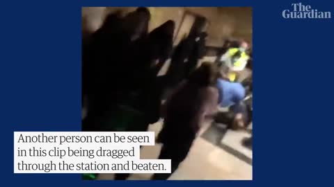 People run for cover as Iranian police open fire during protest at Tehran metro station