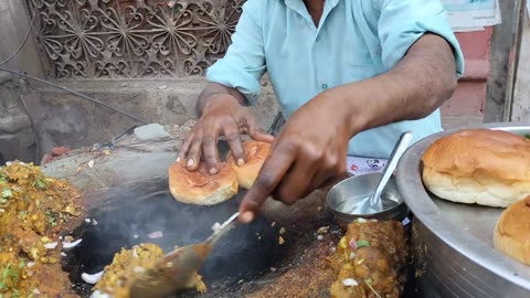 indian street food- 15rs aloo burger Street vendor while cooking with his own bycycle