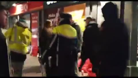 An Irish policewoman has taken placards, which call for Taoiseach Leo Varadkar to resign,