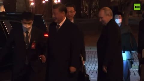 Putin escorts Xi to his car following the talks