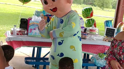 Houston mascot party character jj baby wheels on the bus at birthday party in Kitty Hollow Park