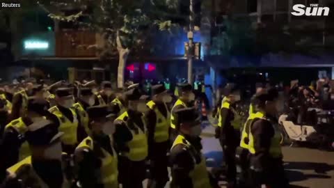 Riot police in Shanghai drag and detain anti-Covid restriction demonstrators