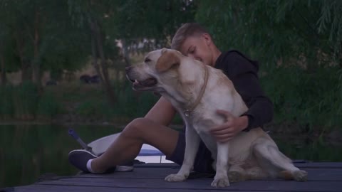 Young boy and dog outdoors