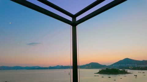 Sunset Over the Beach Viewed Through a Glass Barrier