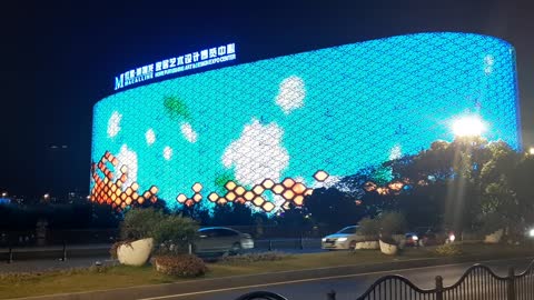 Giant LED wall creates colorful design in the night