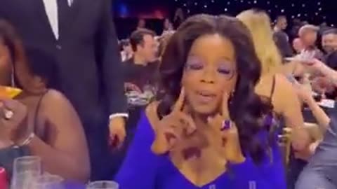 Oprah being served pizza in a bag at the Critics Choice Award show....