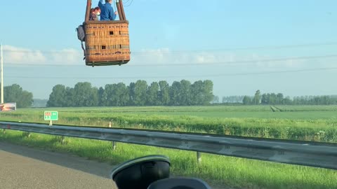 Hot Air Balloon Landing Close to the Road