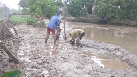 Farmer family digging land