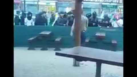 man gets surrounded by invaders and is beaten to an inch of his life