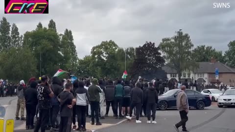 Tensions in Birmingham as men in balaclavas gather