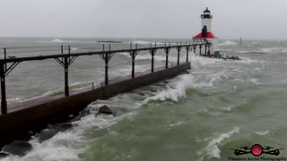 Insane monster waves crashing over lighthouse drone footage