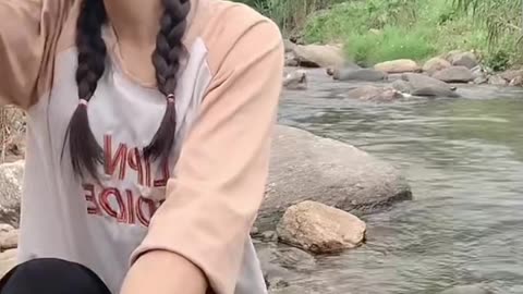 Washing cloths on river