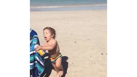 Collab copyright protection - baby falls on sand slow motion beer