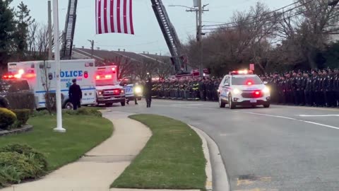 More than 1,000 NYPD officers watch the arrival of Officer Jonathan Diller at the