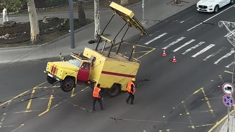 Driver Helped Out Of Rearing Truck