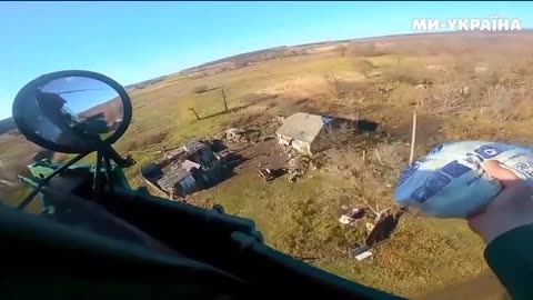 The pilot of the Ukrainian Mi-8 drops candy to girls who constantly met our pilots