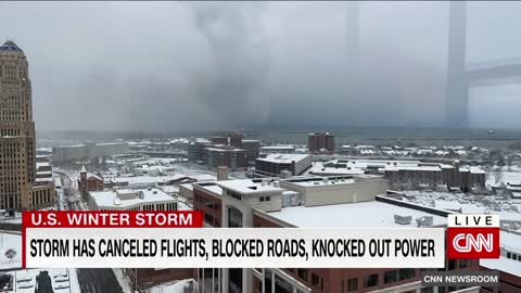 Woman tries to walk in deep snow after massive storm hits New York