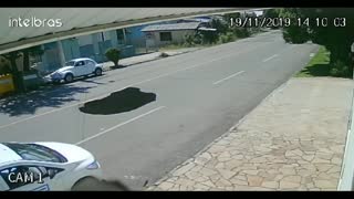 Hole Swallows Car Whole