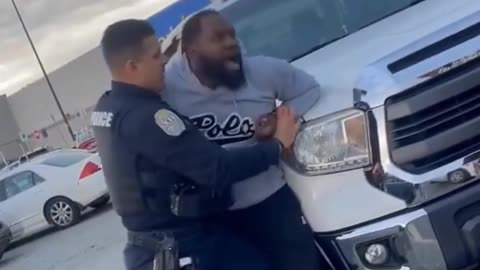 Man gets into a physical altercation with a police officer in a Walmart parking lot