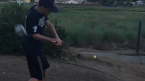 Golf ball toss and hit it out of the air