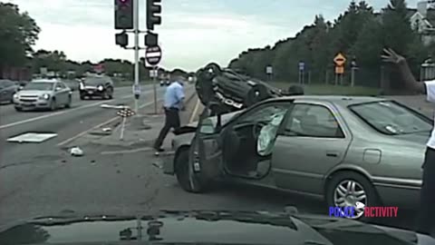 Dashcam Shows Police Car Hit After Chasing Red Light Runner