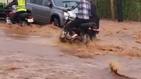 Kampala floods sweep a woman off a boda boda alive