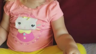 Toddler singing happy birthday to her mom