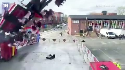 Terrifying moment fairground ride falls apart while in mid-air