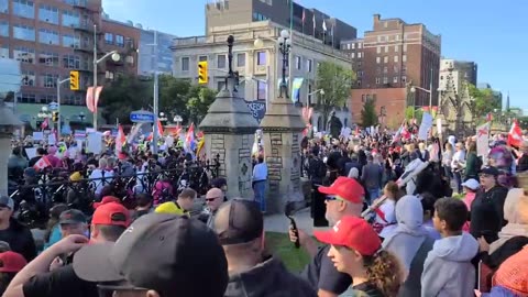 Protestors at the Ottawa anti-LGBTQ rally with many people carrying signs "Leave our kids alone"