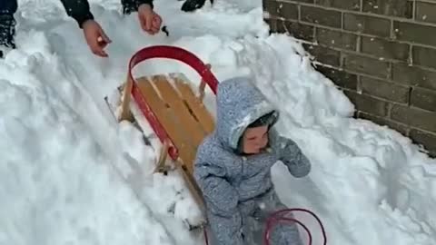 Baby playing with his father